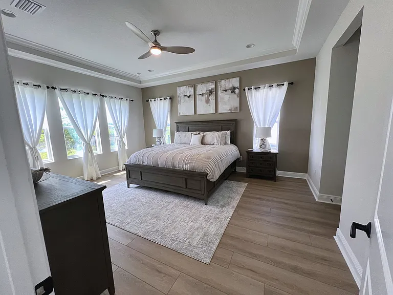 Spacious primary bedroom with a king bed