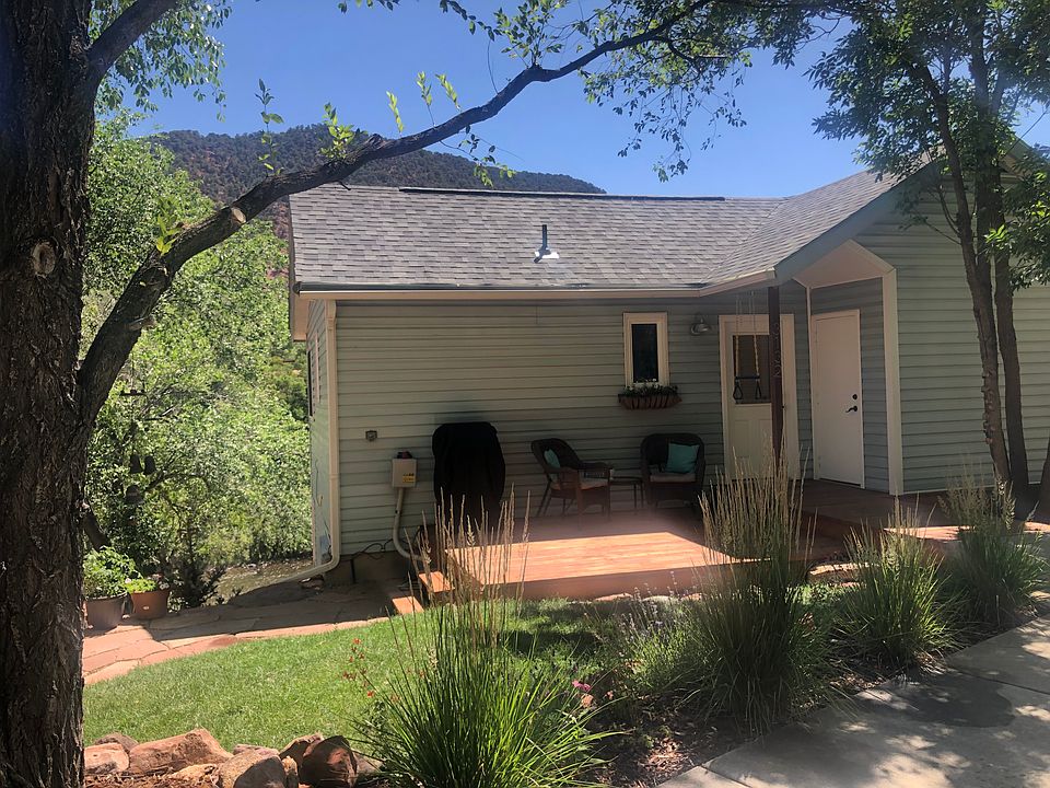 Enjoy the deck, grill and landscaped yard.
