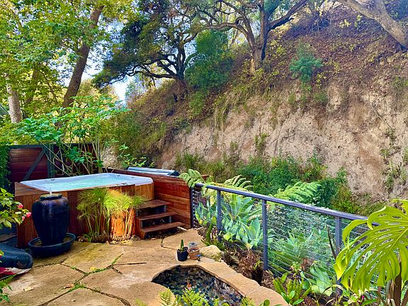 The jacuzzi and cold plunge sitting directly over Sycamore Creek.