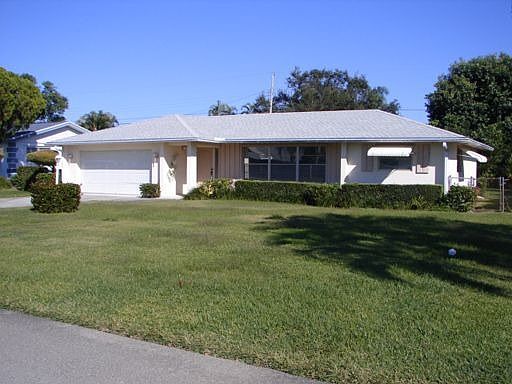 Front with beautiful lawn