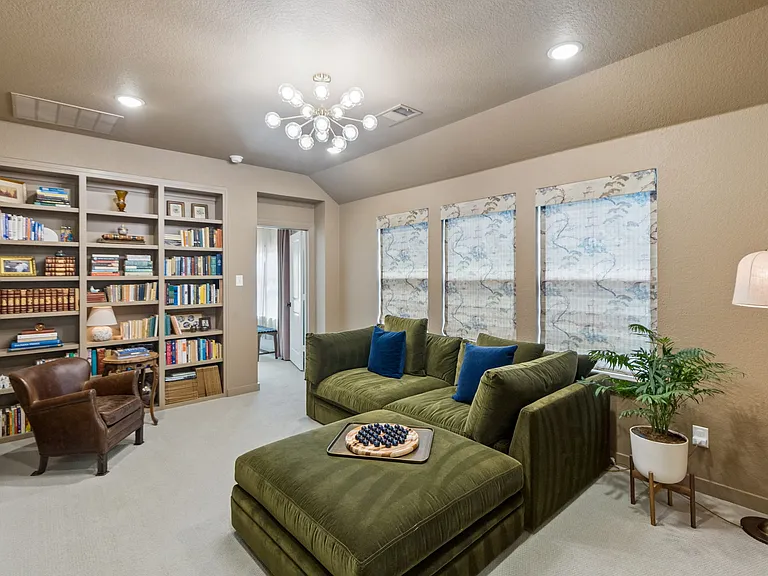 Library off primary bedroom with smart TV.