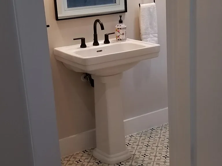Beautiful bathroom tile and pedestal sink.