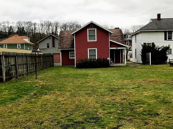 House sits at the back of lot with a large level front yard!