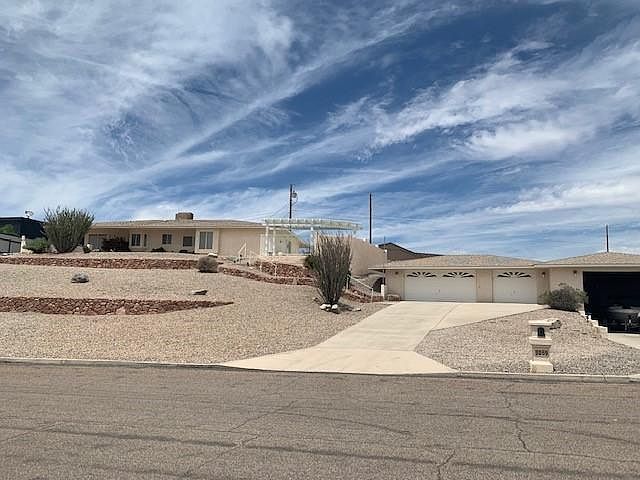 Front view of house up top, garage below.