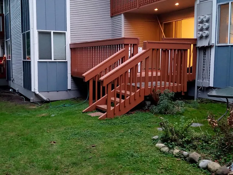 Back porch with some private green lawn.