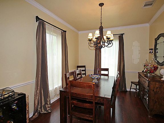 The Formal Dining Room is the ideal place to enjoy special meals and host fabulous dinner parties! The neutral wall tones, stylish moldings, upgraded chandelier and gleaming floors all contribute to the inviting and elegant ambiance