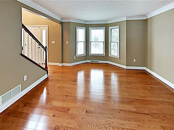 Majority of home has gleaming hardwood flooring.