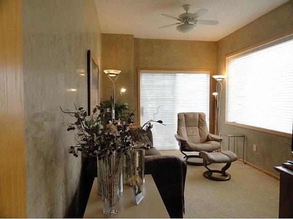 Sunroom shows off Patio door to patio and overlooks the bay! Have coffee and enjoy the morning sun!
