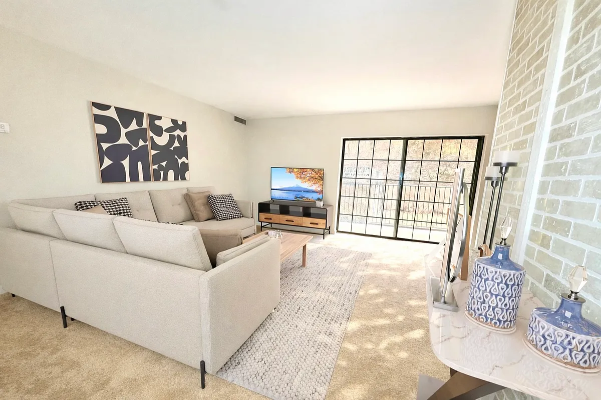 1/2 Bedroom - Living Room (Staged) - Colonial Arms Apartments