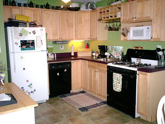 Kitchen Completey Redone With New Cabinets, Appliances, Fixtures, and Floors
