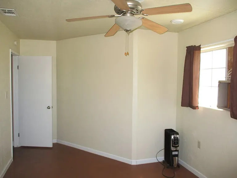 1/2 the bedroom area. Notice painted concrete floor easy clean up with JUST water.