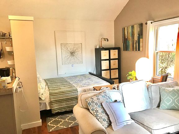 looking from front door past couch to sleeping nook (Q size bed)