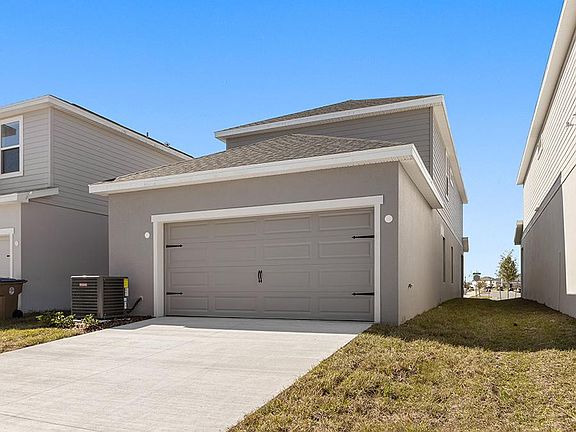 The Capri bungalow includes an attached 2-car garage, located at the rear of the home.