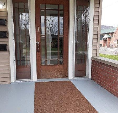 Large front porch offer plenty of room for outdoor furniture.