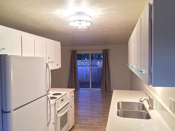 Kitchen, looking toward living room and back patio
