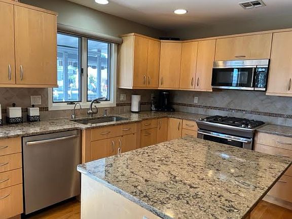 updated kitchen, stainless steel appliances, granite countertops.