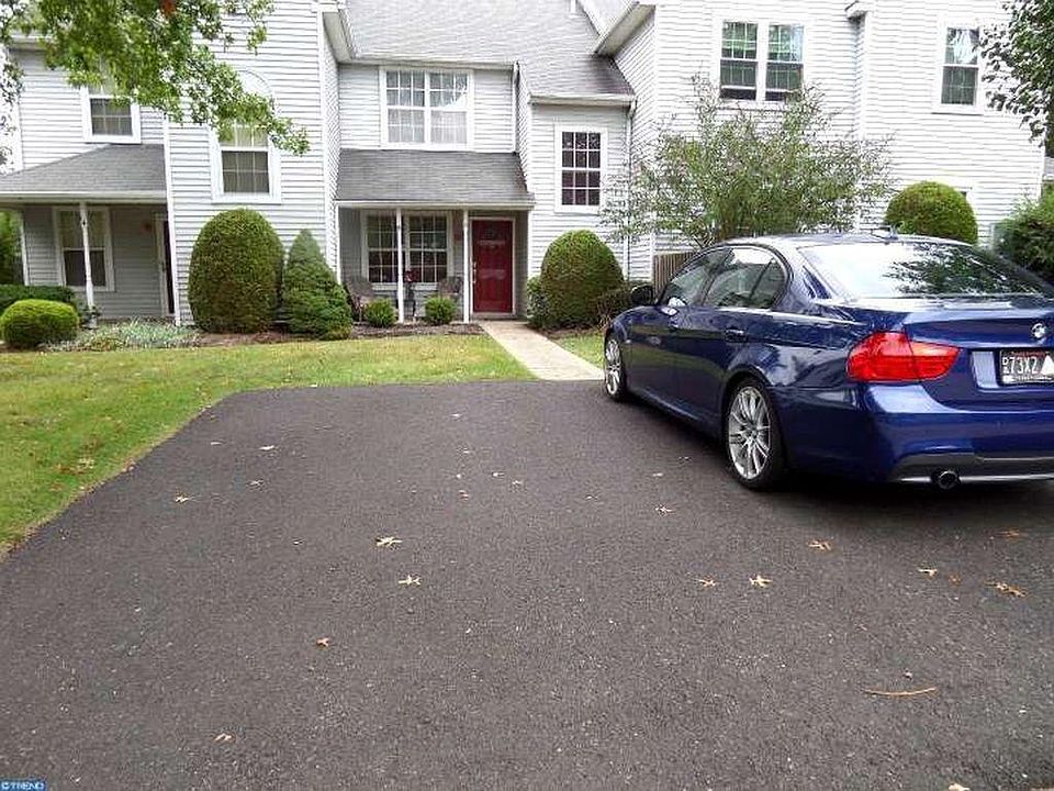 Front of house with two off-street parking spots.
