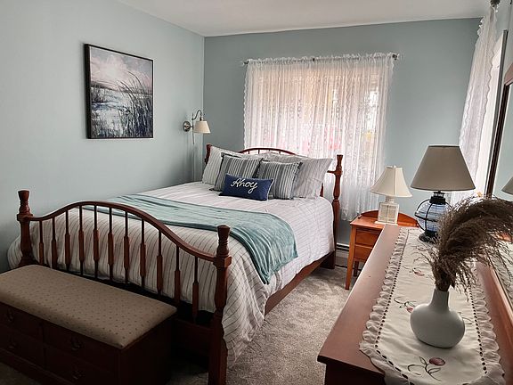Primary bedroom. The furniture can stay or go depending on your needs.