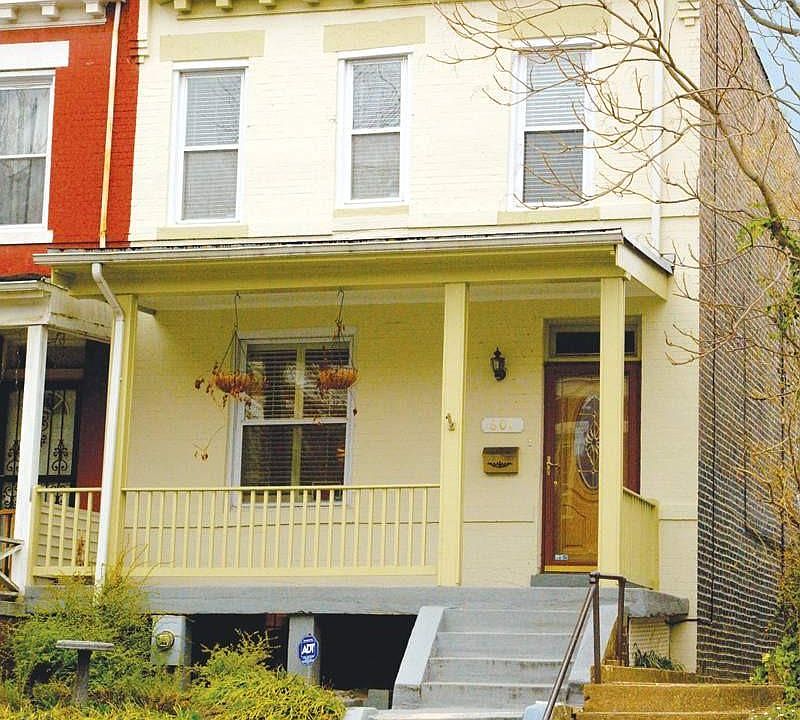 Row house with charming porch