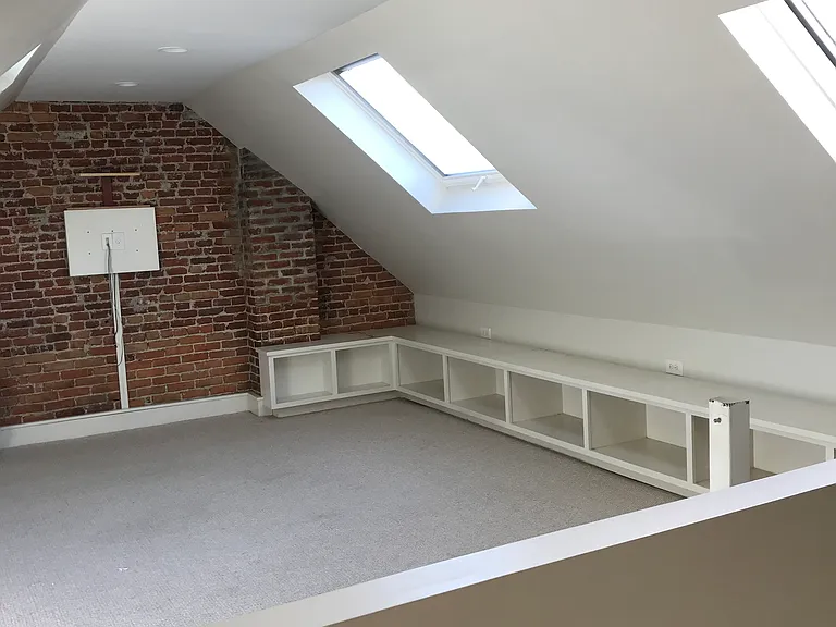 3rd floor with built-in cabinets and large skylights and TV hookup