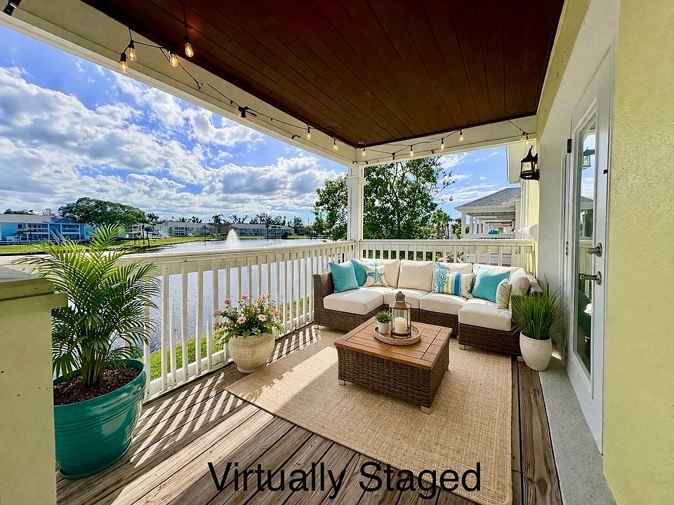 Covered Patio overlooking the lake - VIRTUALLY STAGED