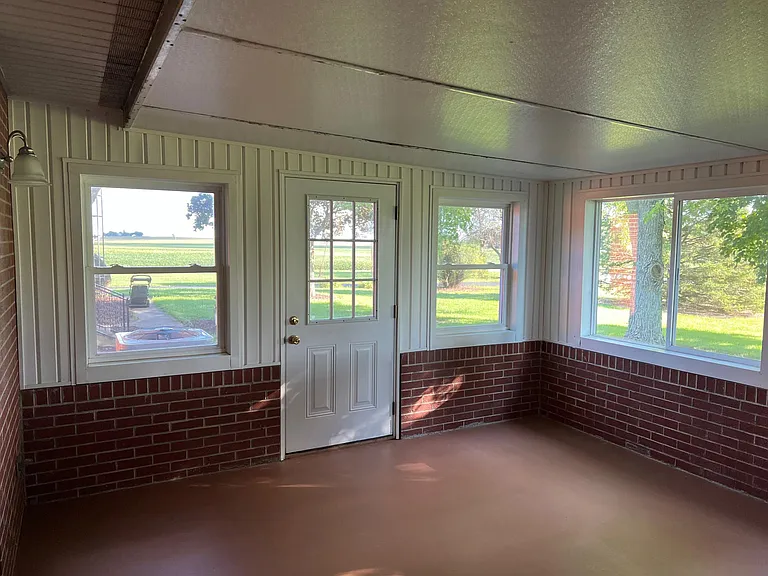 Sun room with outside door and sliding windows for cross ventilation 
14'4" x 13' 4"