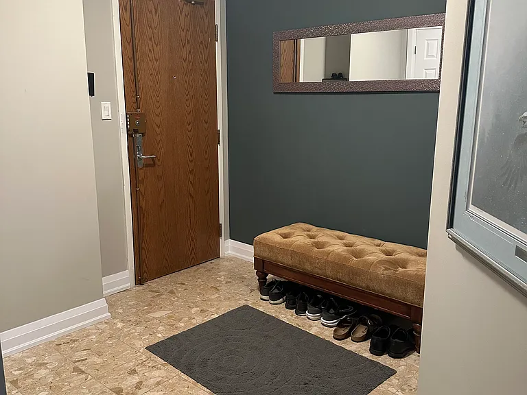 Entrance with two closets providing ample storage