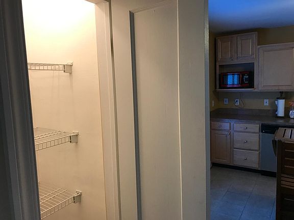 Storage pantry adjacent to kitchen