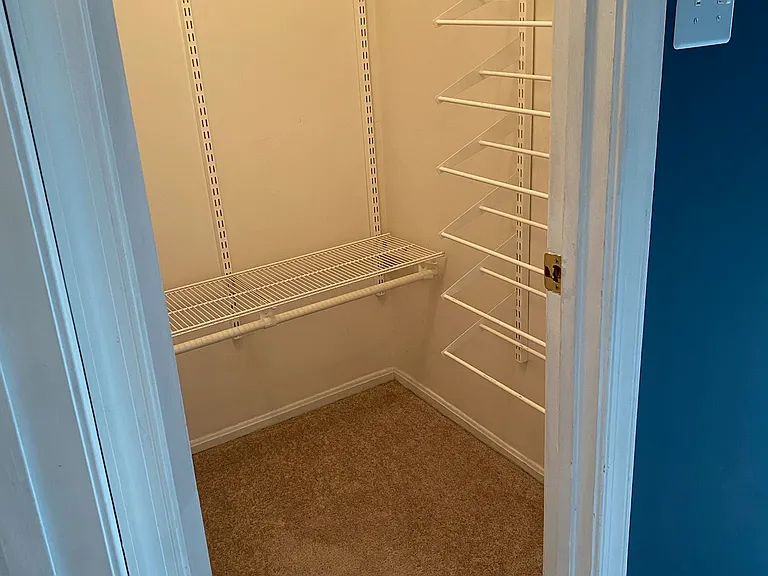 One of two closets in the primary bedroom