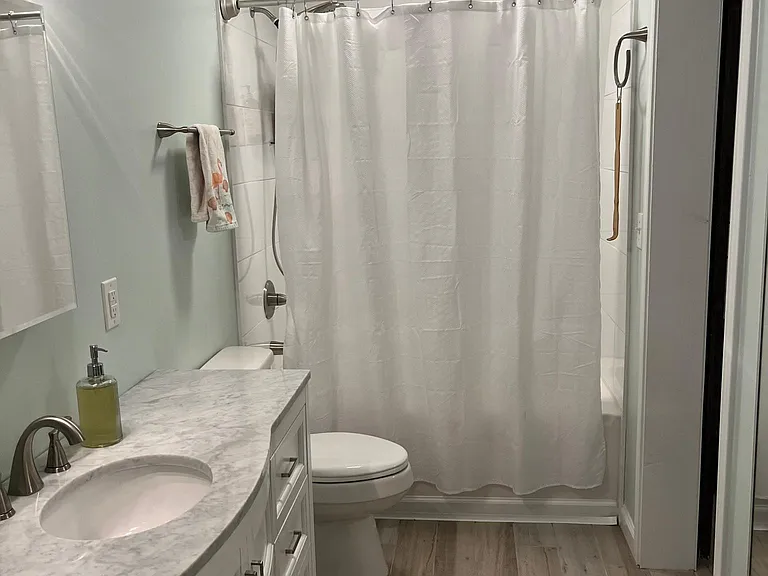Bathroom has a door to bedroom and a door to great room.
