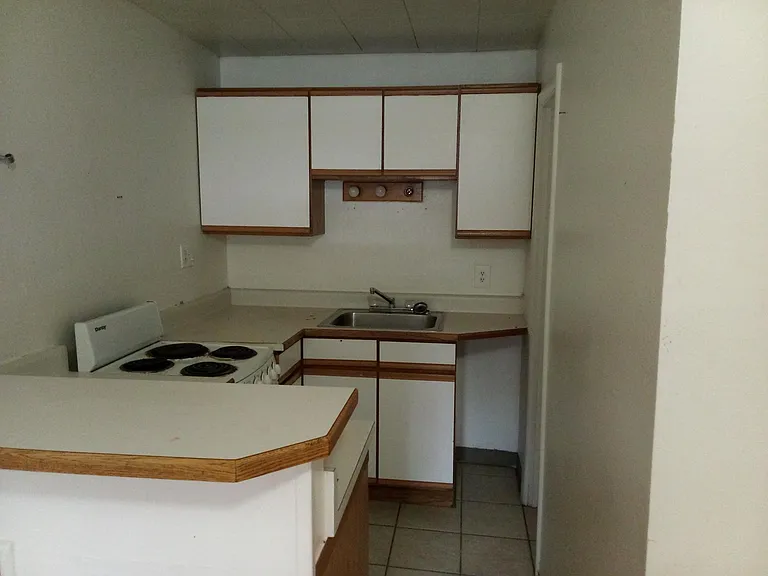 Unit 16 - features a full kitchen with oven.