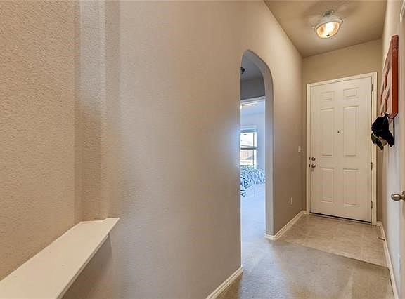 Upon entering the home, there are two bedrooms and a full bathroom.