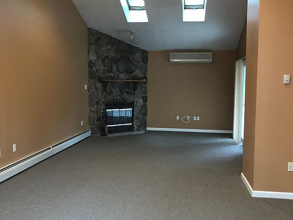 Large family room with wood burning fire place