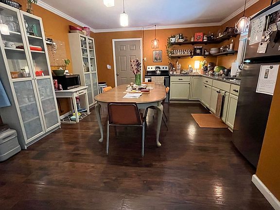 Kitchen open to Living room and door to back covered porch