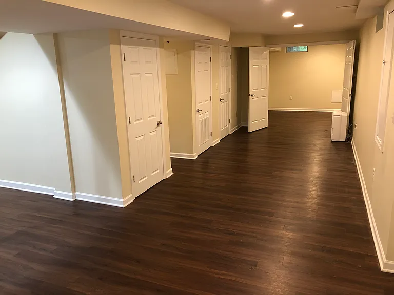 Basement facing West and double doors leading to bonus room.