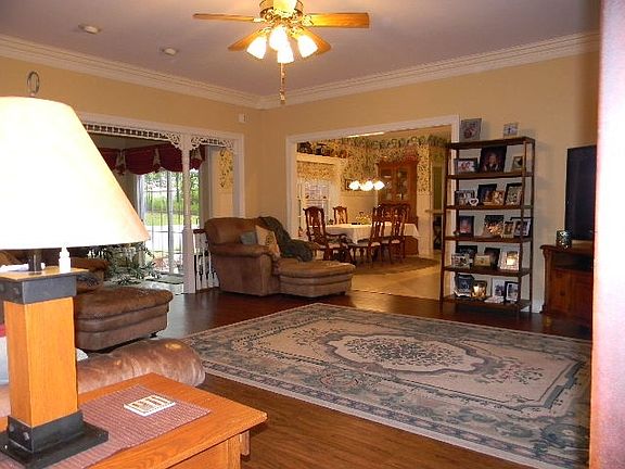 Large greenroom open to sunken sunroom and dining area.