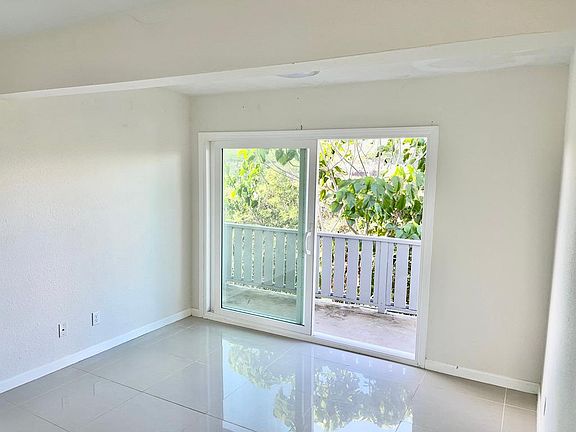 Bedroom 1 with sliding door opening to deck.