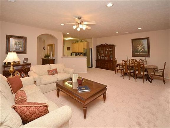 The large den/dining room is designed to accommodate almost any furniture size.