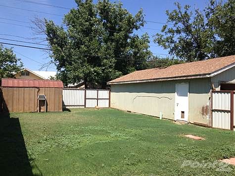 FENCED YARD WITH MATURE PECAN TREES