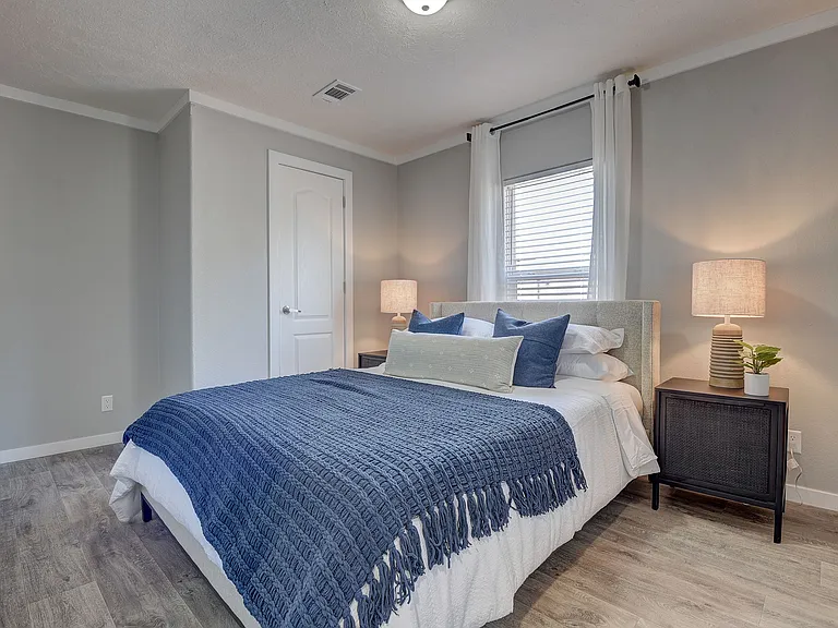 Comfortable, light-filled bedroom with clean modern finishes and a relaxing, move-in-ready feel.