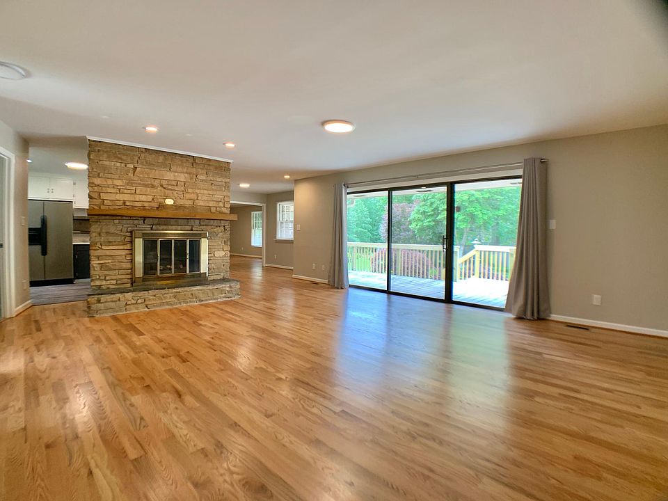 Gorgeous floors, big sliding glass door & windows bringing outside in.