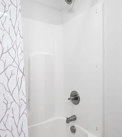 Upstairs hallway bath tub/shower.