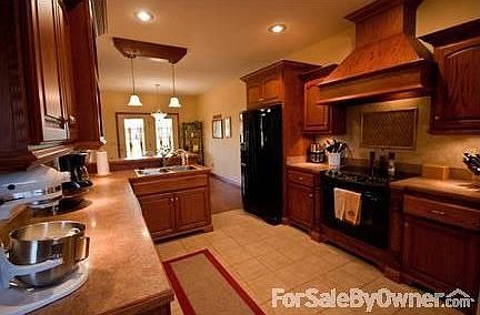 Kitchen
						:
						Tile floor and back-splash. Custom Oak Cabinets.