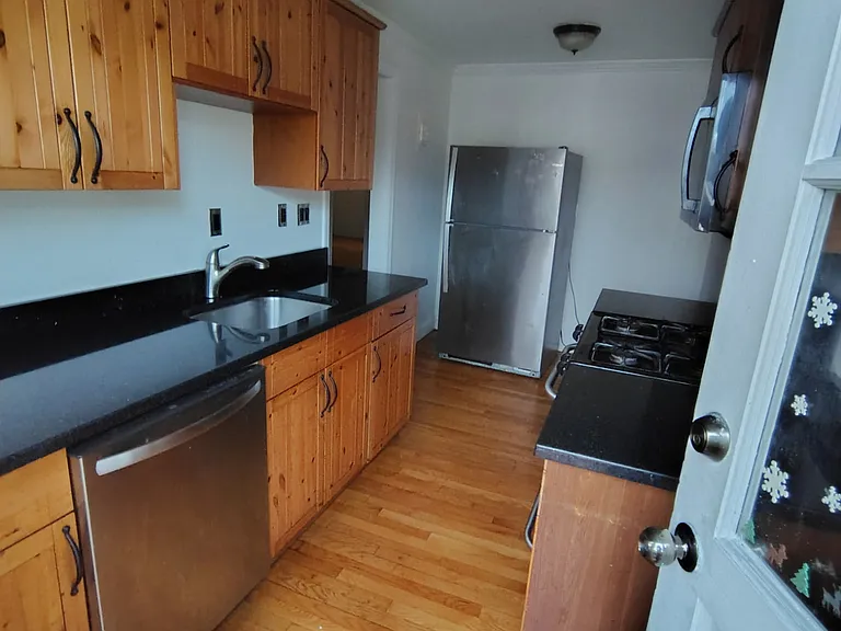 Full kitchen with refrigerator, microwave, dishwasher