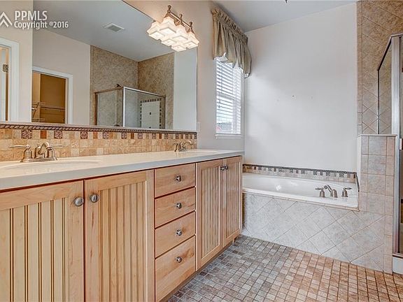 Elegant Master Bath With Upgraded Cabinets & Beautifully Designed Tile Accents