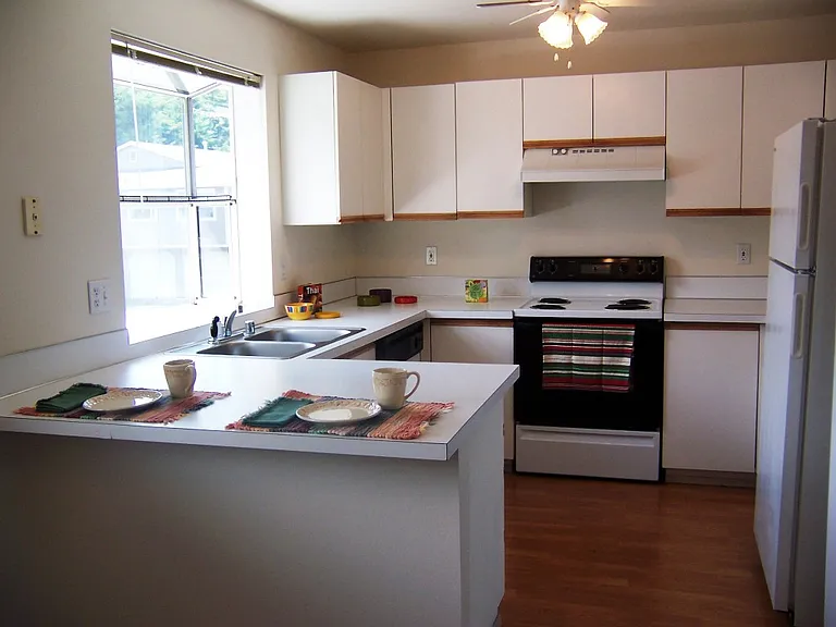 Upstairs rambler. Gotta love these kitchens! Lots of cupboard space and lots of counter space and lets not forget the self cleaning oven!