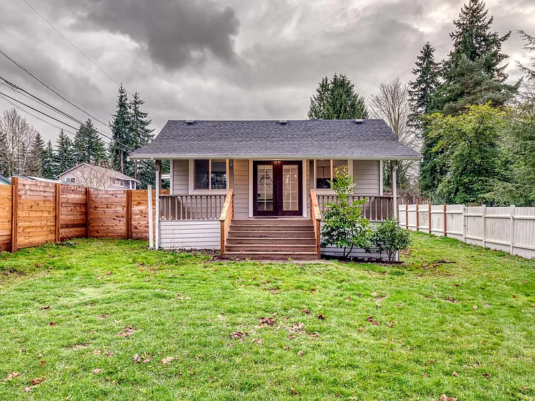 This is the front of the house with the 1905 farmhouse patio! Over the years the road on the side of the house developed and guests will be entering from the mudroom on the side of the house!