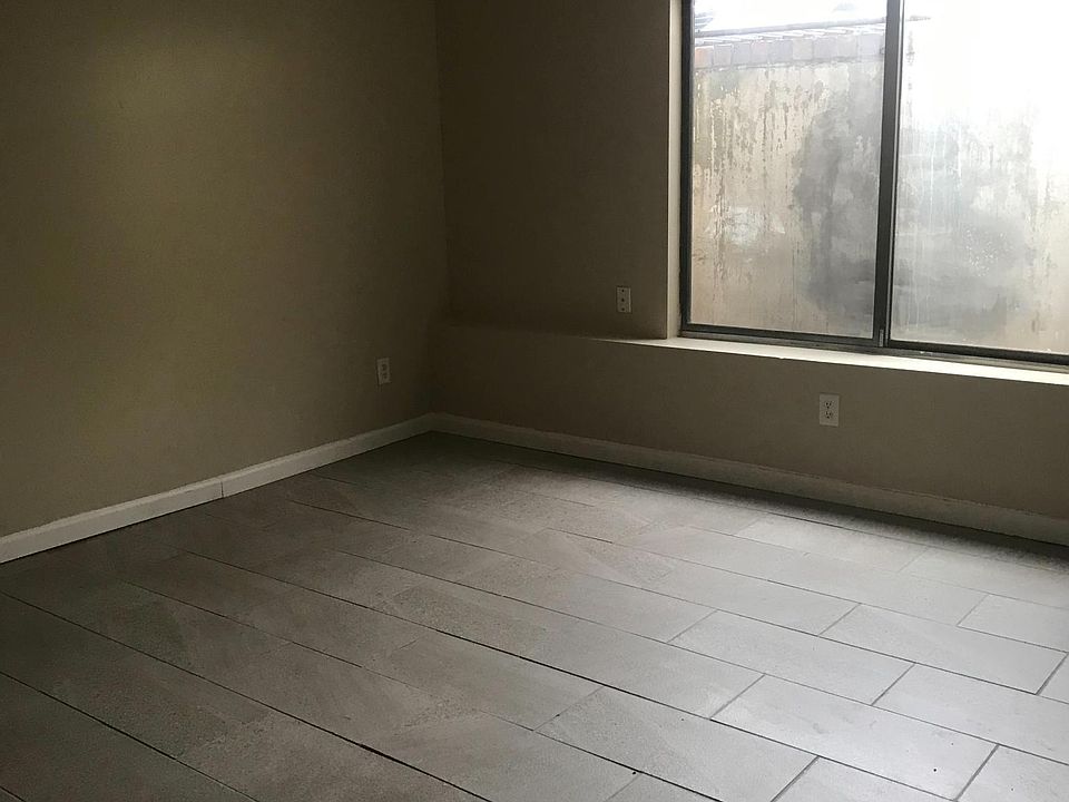 Beautiful tile floors in large living area.