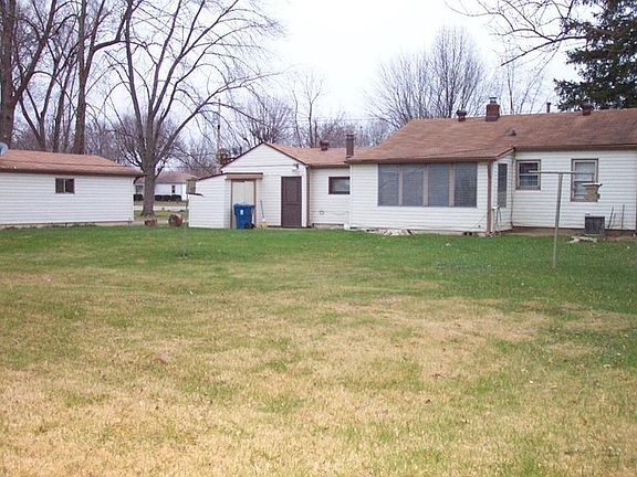 View from the backyard of house and detached garage