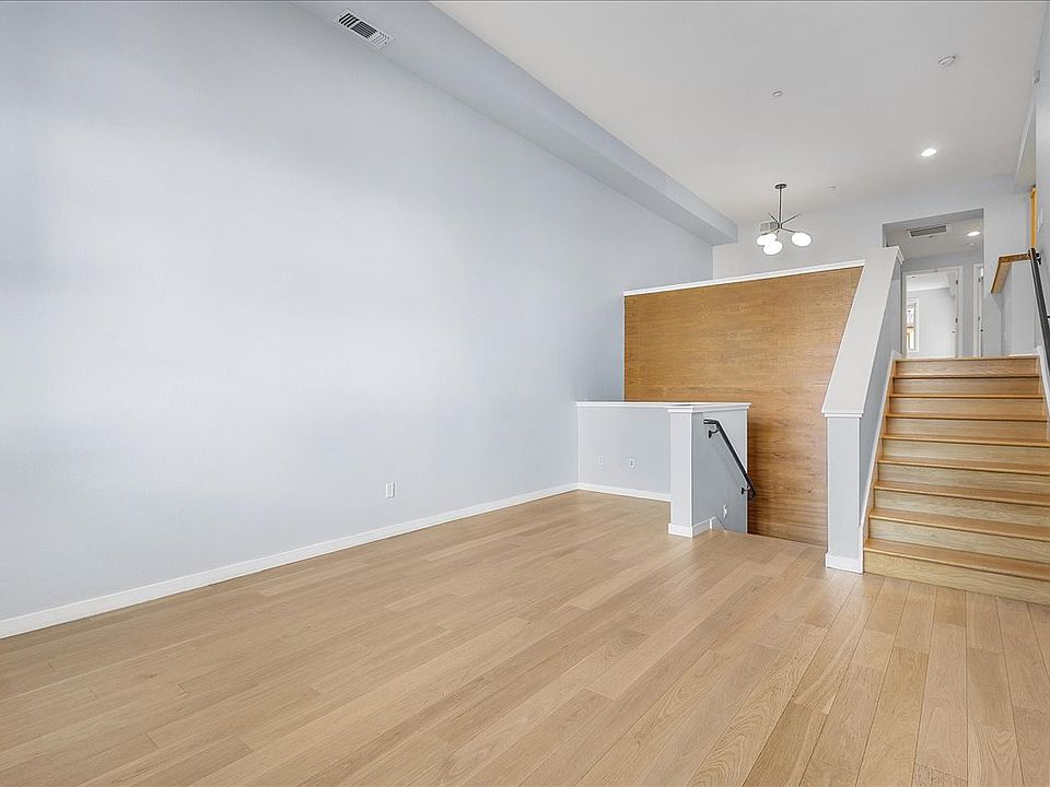 Open, loft-like layout with hardwood flooring throughout.